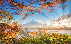 Mt. Fuji over Lake Kawaguchiko with autumn foliage at sunset in Fujikawaguchiko, Japan