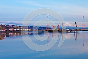 Mt.Ranier and Tacoma port with cranes and bridge.