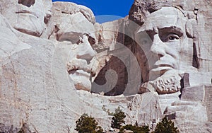 Mt. Rushmore close up of Theodore Roosevelt and Abraham Lincoln