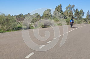 MTB Cyclist speeding down by local road