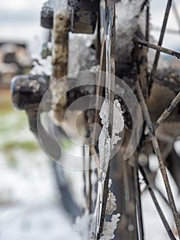 MTB disc brake with rest of snow and wet drops. Biking in winter