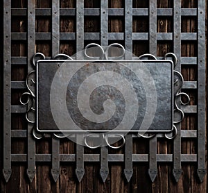 Mteal plate on medieval castle gate or wall background