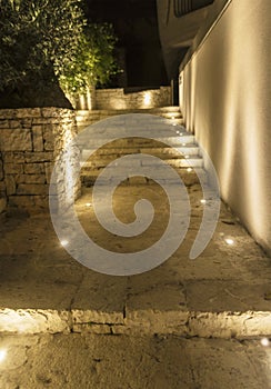 Steps made of stone illuminated by the light of the evening