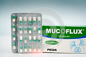 Mucoflux 100 mg. Cyclidrol product of MEDA Pharma Thailand. Manufactured by Fulton Medicinali, Italy. Green-white capsules