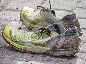 Mud covered running shoes