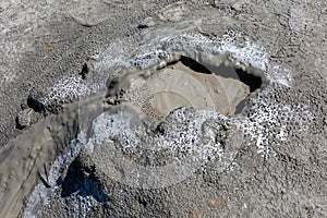 Mud geyser or mud volcano. Geological formation hydrogeological
