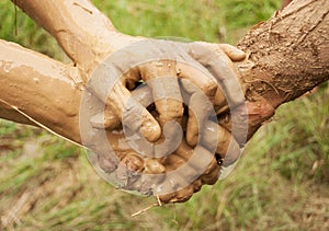 Mud hands connected together