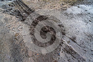 Mud with a puddle on an impassable road