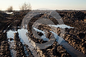 Mud and puddles on the dirt road