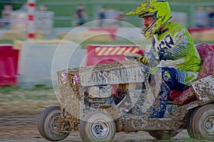 Mud spattered Lawn Mower Racing