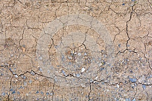 Mud and stone texture of dry crack on the ground in drought season