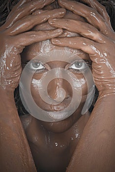 Mud treatment on a woman skin