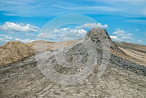 Mud volcano cone and blue sky contrast