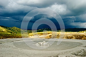 Mud volcano crater and dramatic background