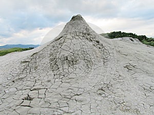 Mud volcano erupting with dirt