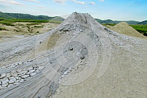 Mud volcano erupting with dirt