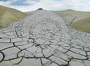 Mud volcano erupting with dirt, vulcanii Noroiosi in Buzau, Romania