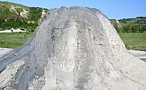 Mud volcano flowing down clayey mud mixed with hydrocarbons. Natural Reserve Salse of Nirano: Modena, Fiorano, Italy