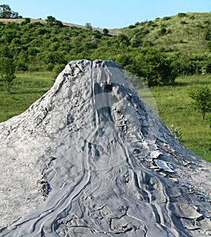 Mud volcano flowing down clayey mud mixed with hydrocarbons. Natural Reserve Salse of Nirano: Modena, Italy