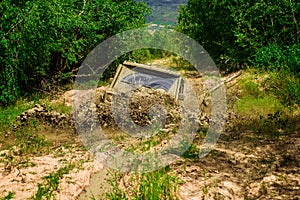 Mud and water splash in off-road racing. Mudding is off-roading through an area of wet mud or clay. Tracks on a muddy photo