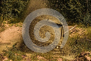 Mud and water splash in off-road racing. Tires in preparation for race. Mud and water splash in off the road racing