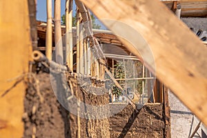 mud and wood wall with bioconstruction technique