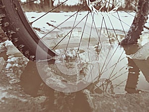 Mudd and water drops on bike tyre. Winter free ride in snowy landscape. low temperature