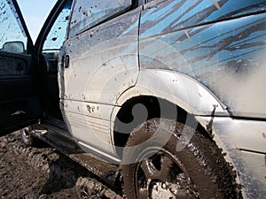 Muddy car with dirty drops