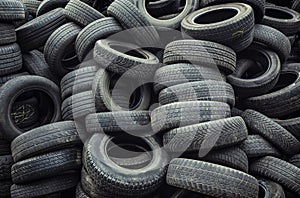 Muddy, dirty, worn car tires pile