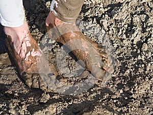 Muddy Feet of a Young Woman