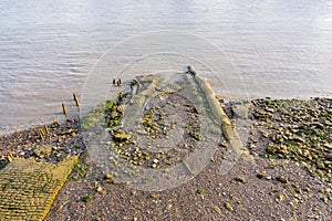 Muddy riverbank at low tide on the River Thames