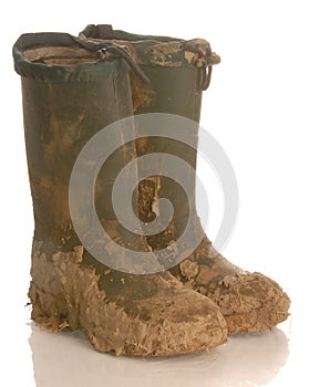 Muddy rubber boots photo