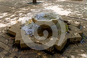 Mudejar fountain in Patio de los naranjos in the cathedral of Seville, Spain photo