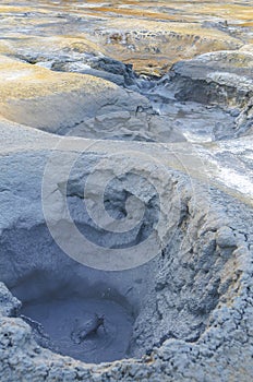 Mudpot Hot boiling mud bubbling steam and exploding at mudpots, the geothermal area Hverir