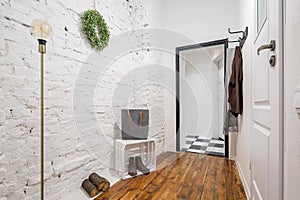 Mudroom with brick wall