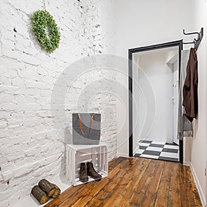 Mudroom with brick wall