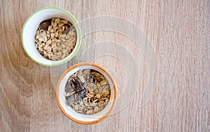 Muesli in bowl on wooden