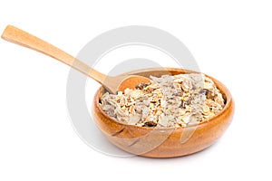 Muesli in bowl and wooden spoon