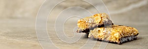 Muesli and cereal bar on marble stone background