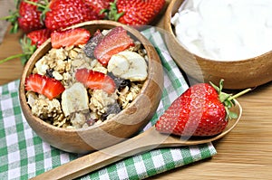 Muesli cereals, yoghurt and fresh strawberries