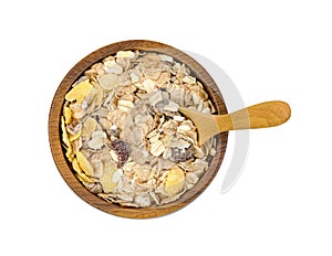 Muesli multi fruit in wooden bowl and spoon isolated on white background ,include clipping path