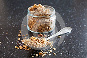 Muesli in a spoon from a jar