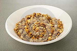 Muesli in white plate on table