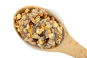 Muesli in wooden spoon isolated on white. Top view