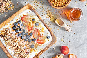 Muesli with yogurt and berries, healthy breakfast