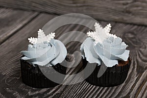 Muffin with cream cheese cream. Decorated with a marshmallow snowflake