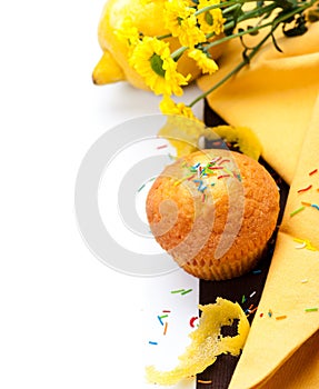 Muffin with lemon, zest and flowers