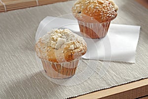 Muffin with sponge on a wooden table