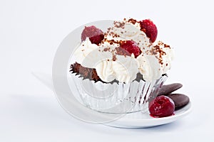 Muffin with whipped cream, cherries and crumbs