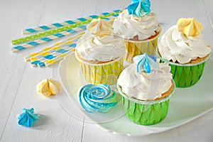 Muffins with cream, wedding or birthday sweet table. Set of cupcakes. Colorful cream muffins. Catering